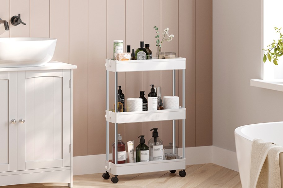 songmics rolling cart in a bathroom filled with personal care items