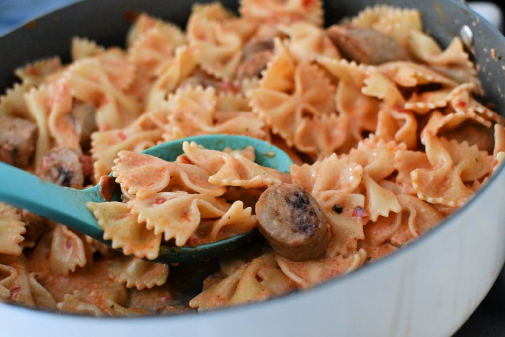 spoonful of cheesy Boursin and sausage tomato pasta