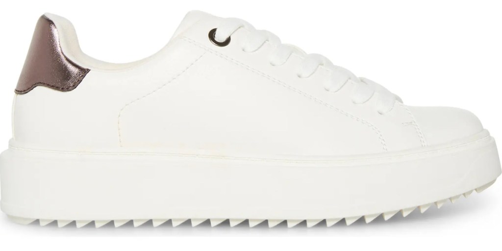 stock photo of white sneaker with gold detail on back