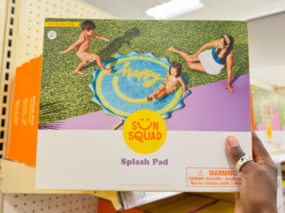 hand holding a box for a splash pad