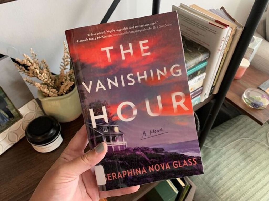 hand holding the vanishing hour book
