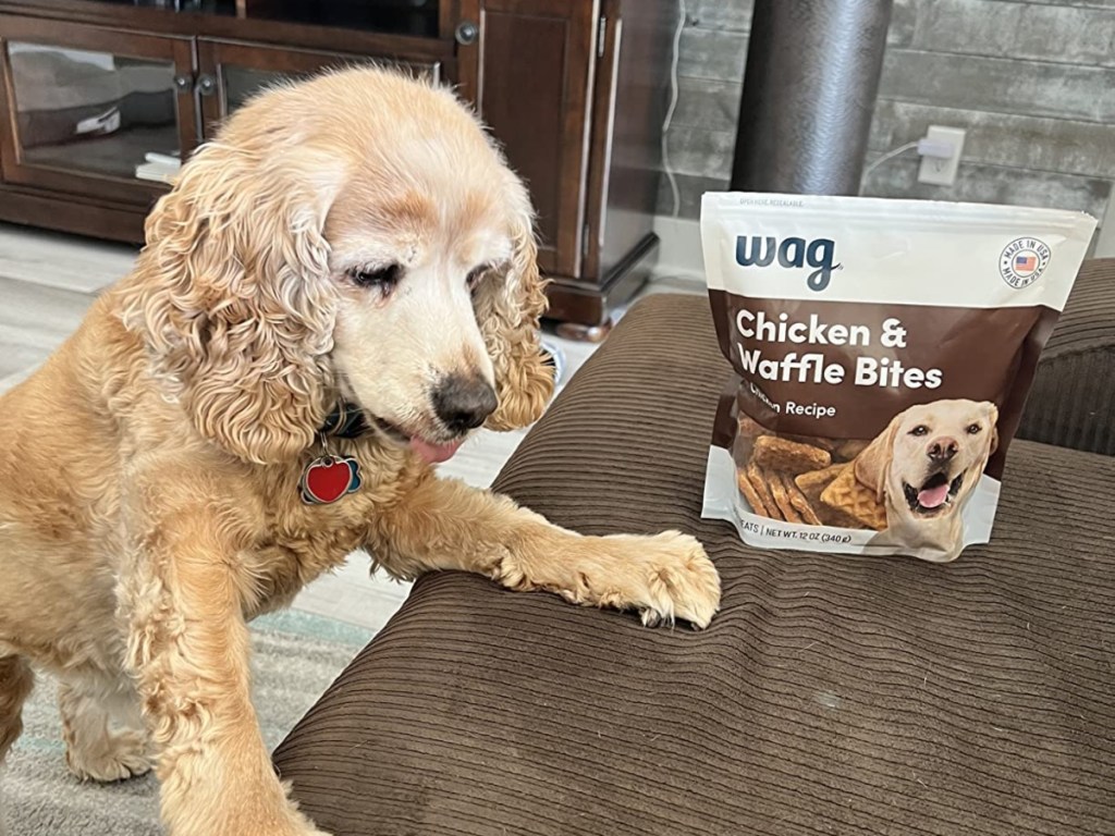 puppy next to bag of chicken & waffle bites