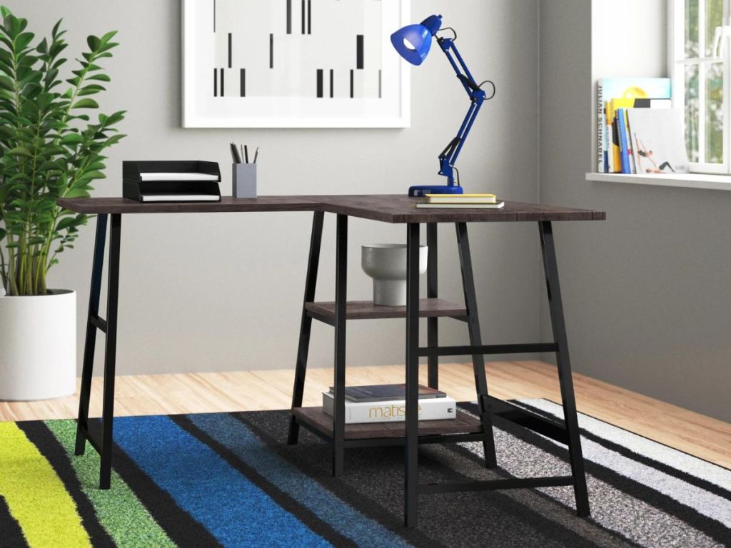 black l-shaped desk in office