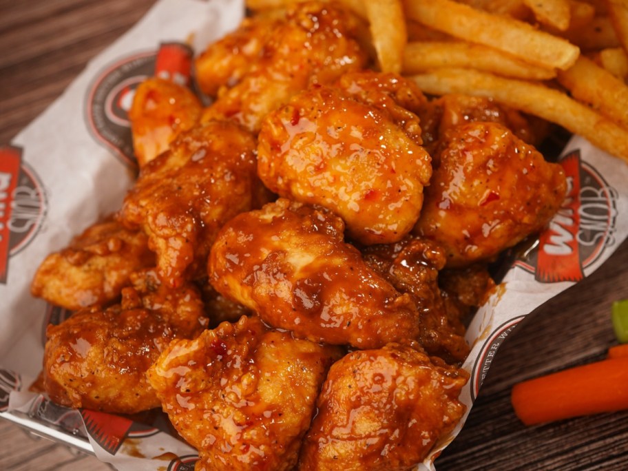 wings and fries in a basket