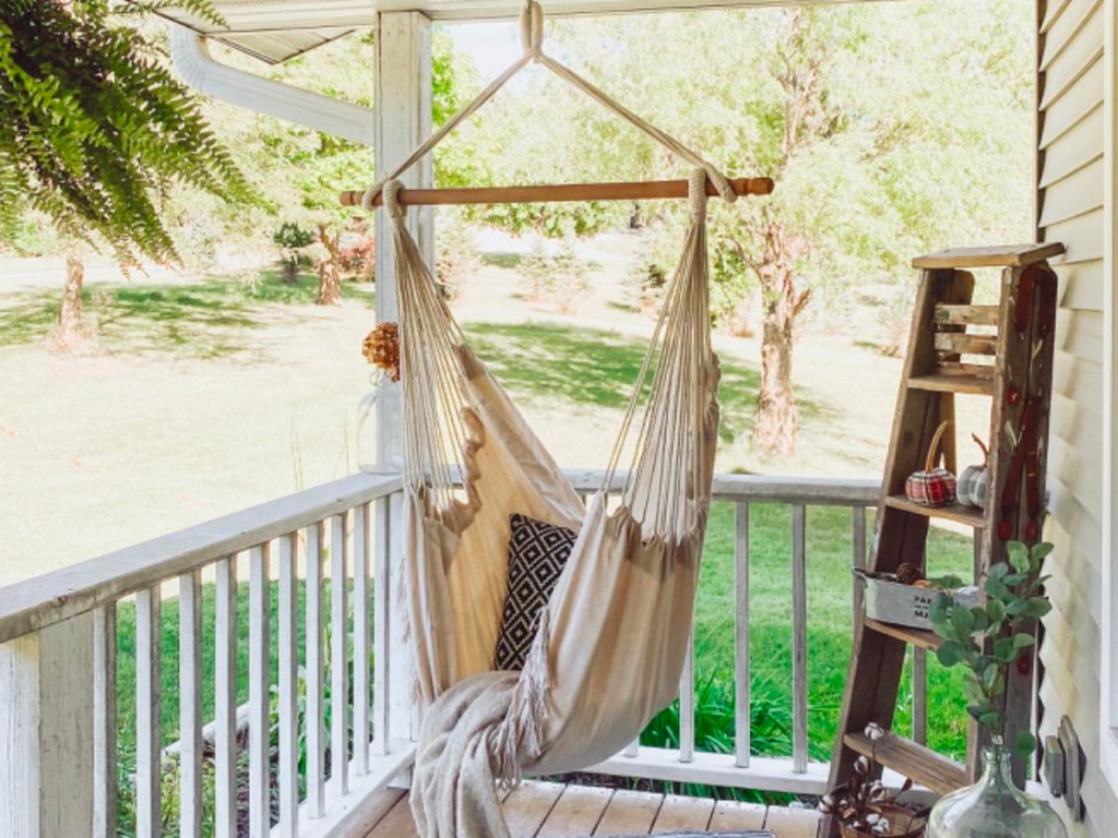 beige hammock hanging on porch