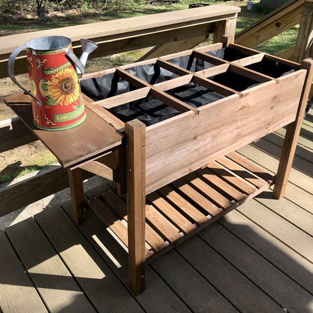 raised garden bed with compartments and table