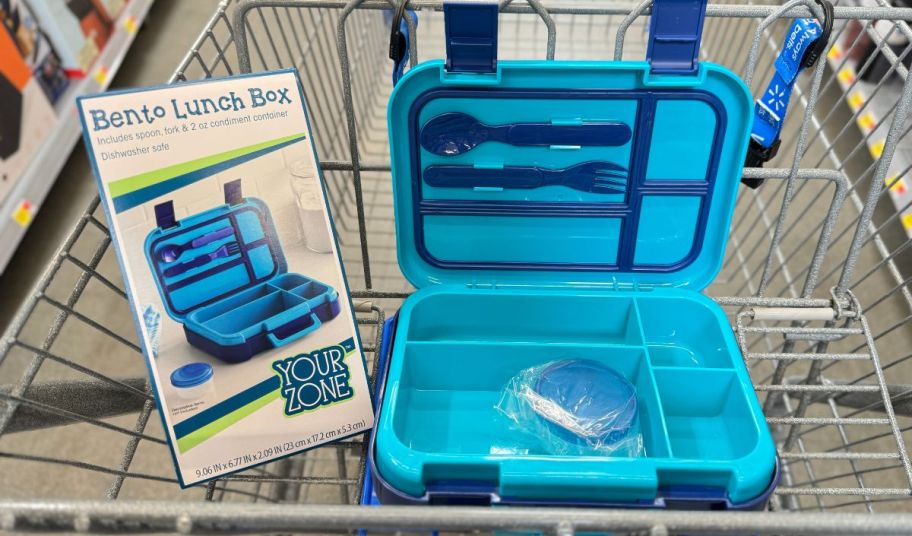 a blue bento box, opened to show contents, in a shopping cart