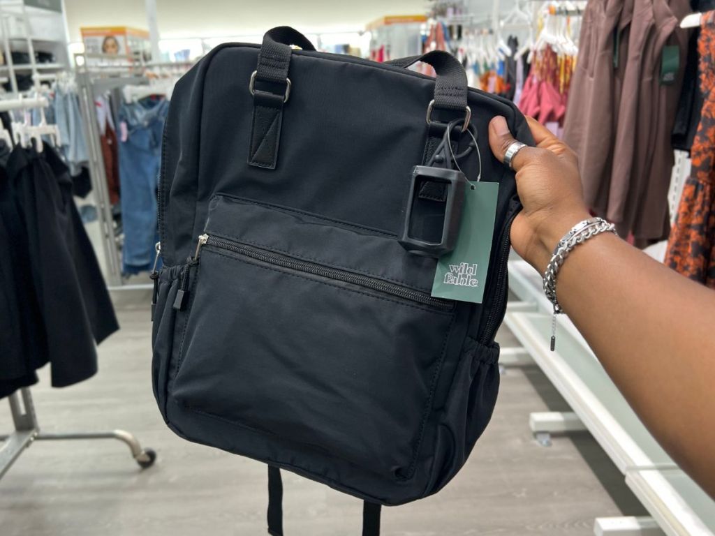 Wild Fable 15.4″ Full Square Backpack at Target in woman's hand