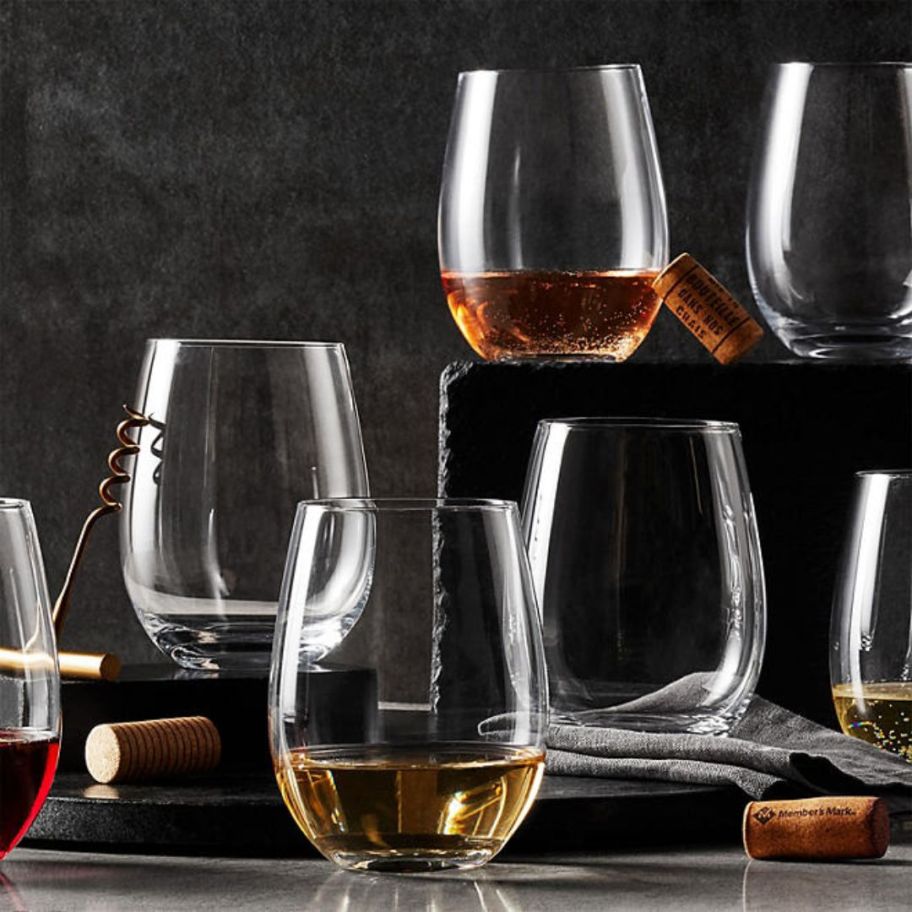 8 stemless wine glasses with wine and corkscrew