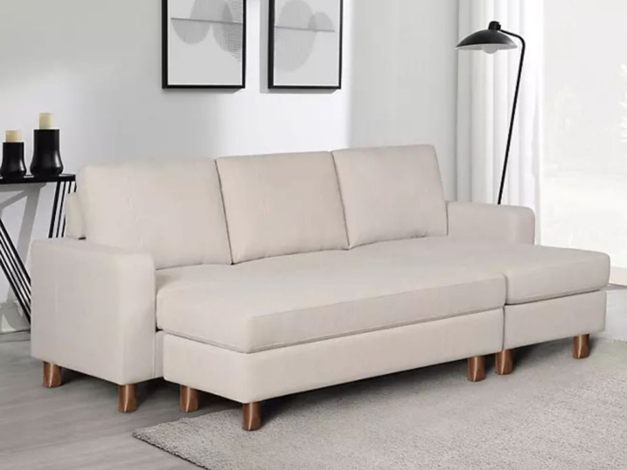 light tan color sectional sofa with ottomans in living room
