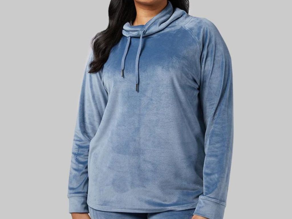 woman wearing blue funnel neck soft velour hoodie