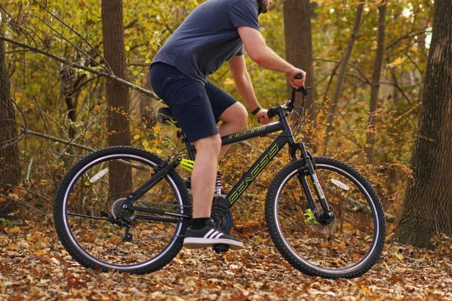 A man on a Genesis bike in the woods