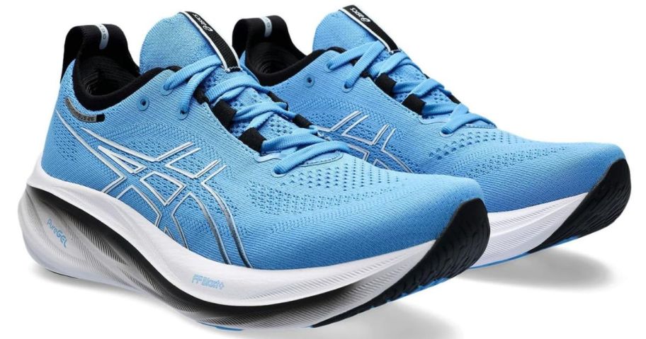 A pair of light blue ASICS GEL-Nimbus 26 running shoes