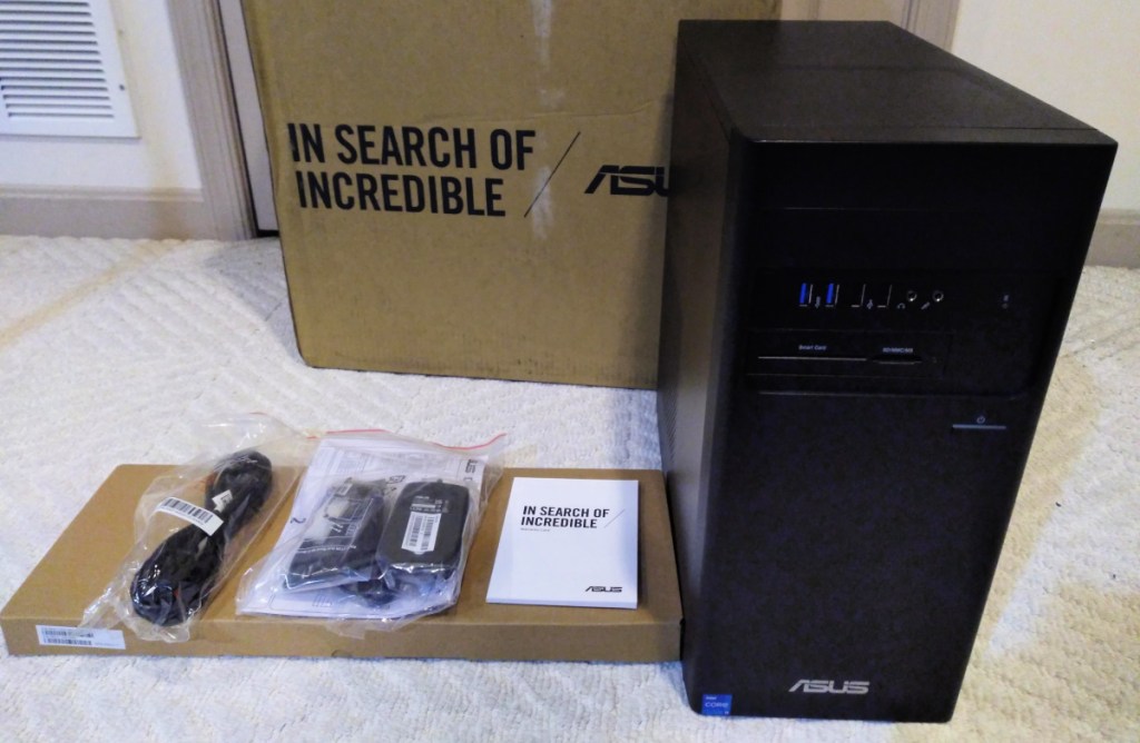 An ASUS Tower next to the packaging