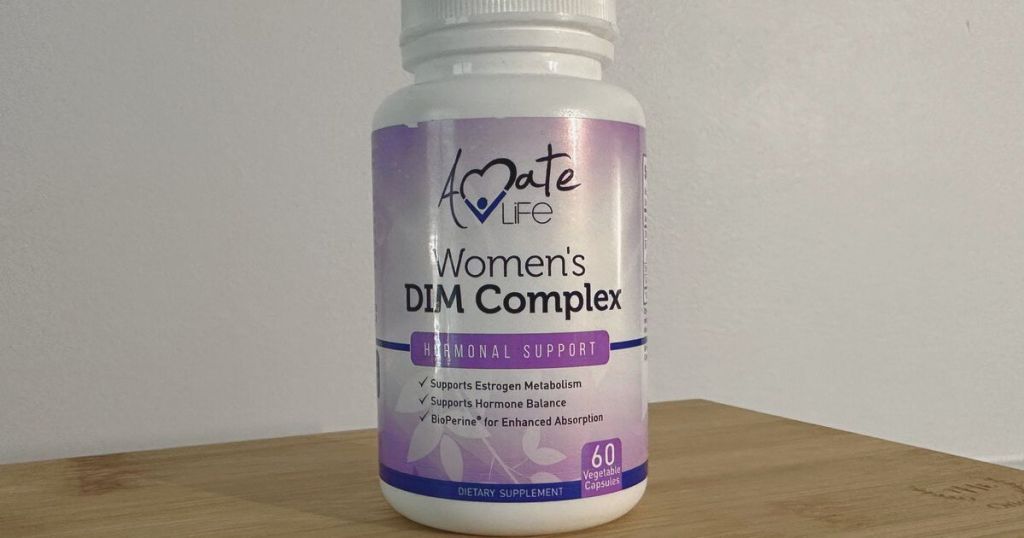 bottle of Amate Life Women’s DIM Complex Bioperine Estrogen Balancing Pills on wood surface