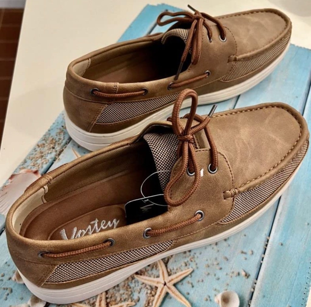 brown boating slip on shoes on top of coastal box