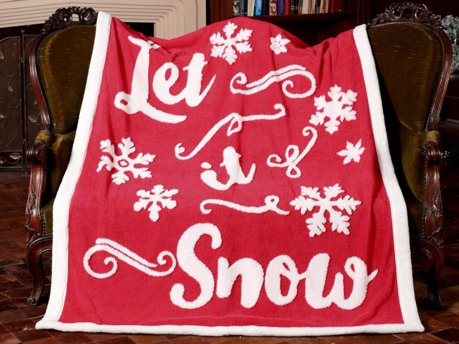 a red "Let It Snow" blanket