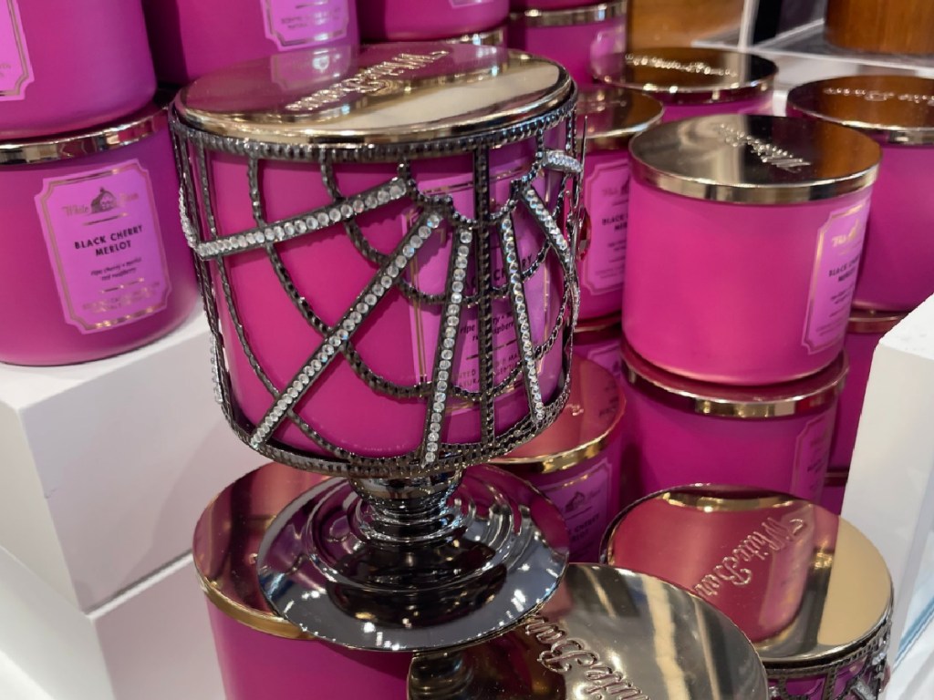 Bath & Body Works Gem Spider Pedestal Candle Holder with candle inside of it displayed at the store