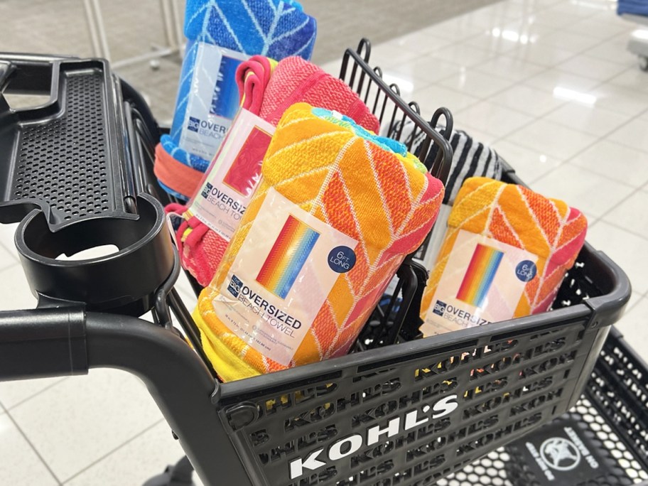 multiple beach towels in a black kohl's shopping cart
