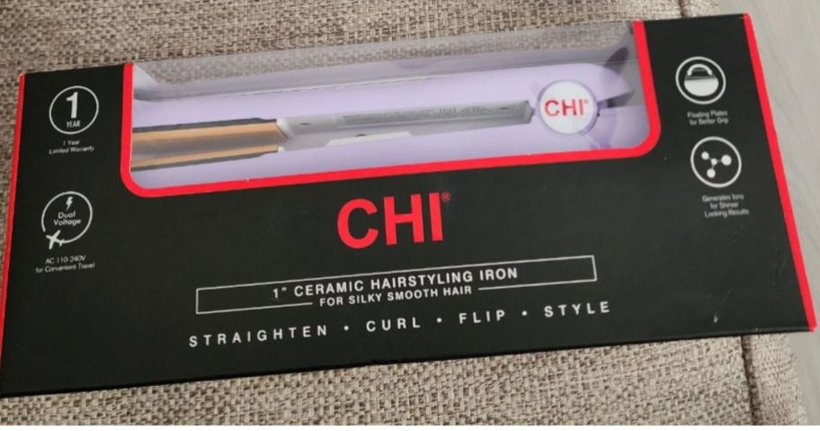 a chi flat iron in a product box on a chair seat. 