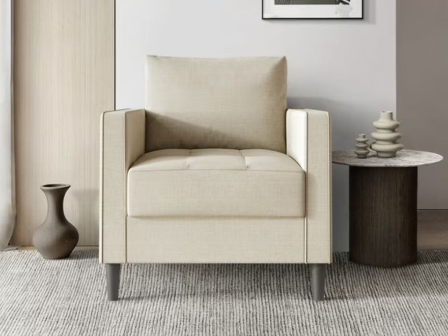 Castle Place Classic Linen Upholstered Armchair in a living room