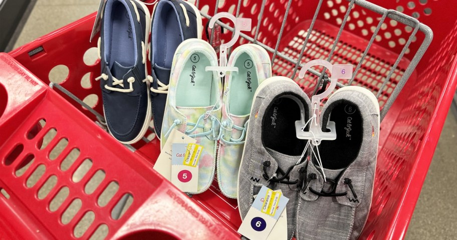 three pairs of kids shoes in red target shopping cart