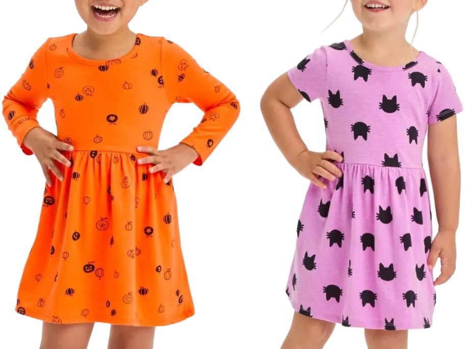 Two girls wearing Cat & Jack Halloween dresses