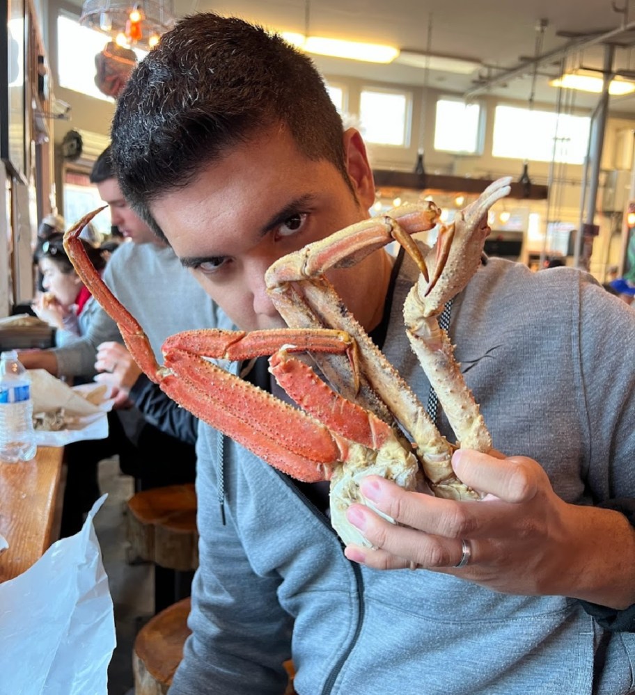 Shane dining on crab legs aboard a cruise ship