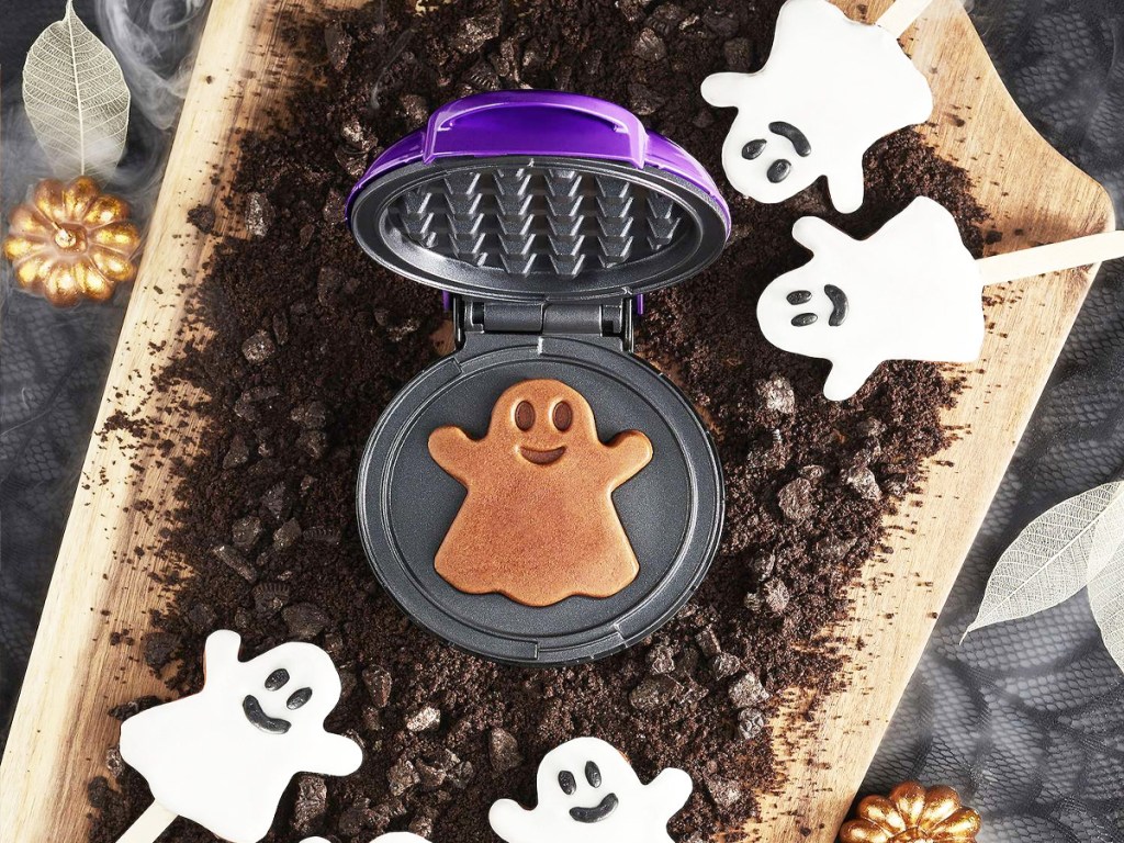 mini ghost waffle maker surrounded by frosted ghosts