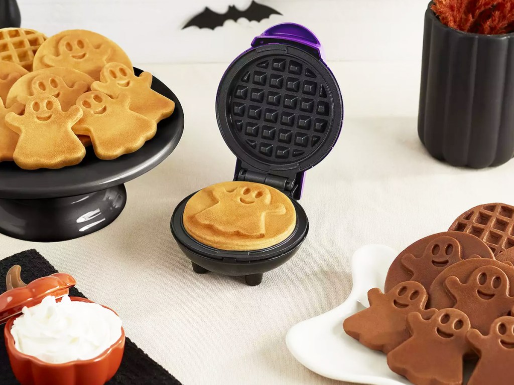 mini ghost waffle maker with plates of mini waffles