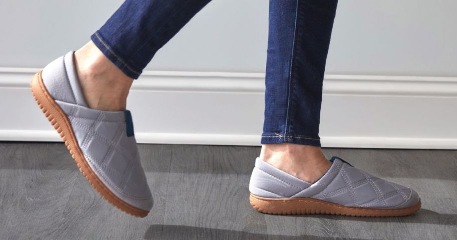 Woman's feet wearing Dearfoams The River Slippers