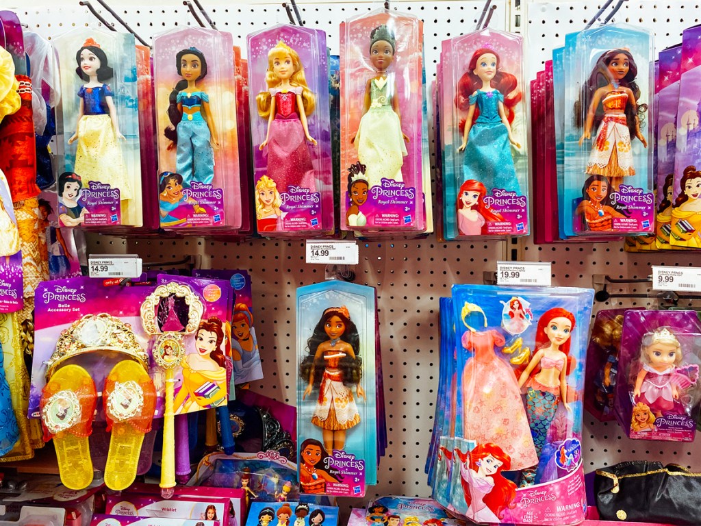 disney princess dolls on store display wall
