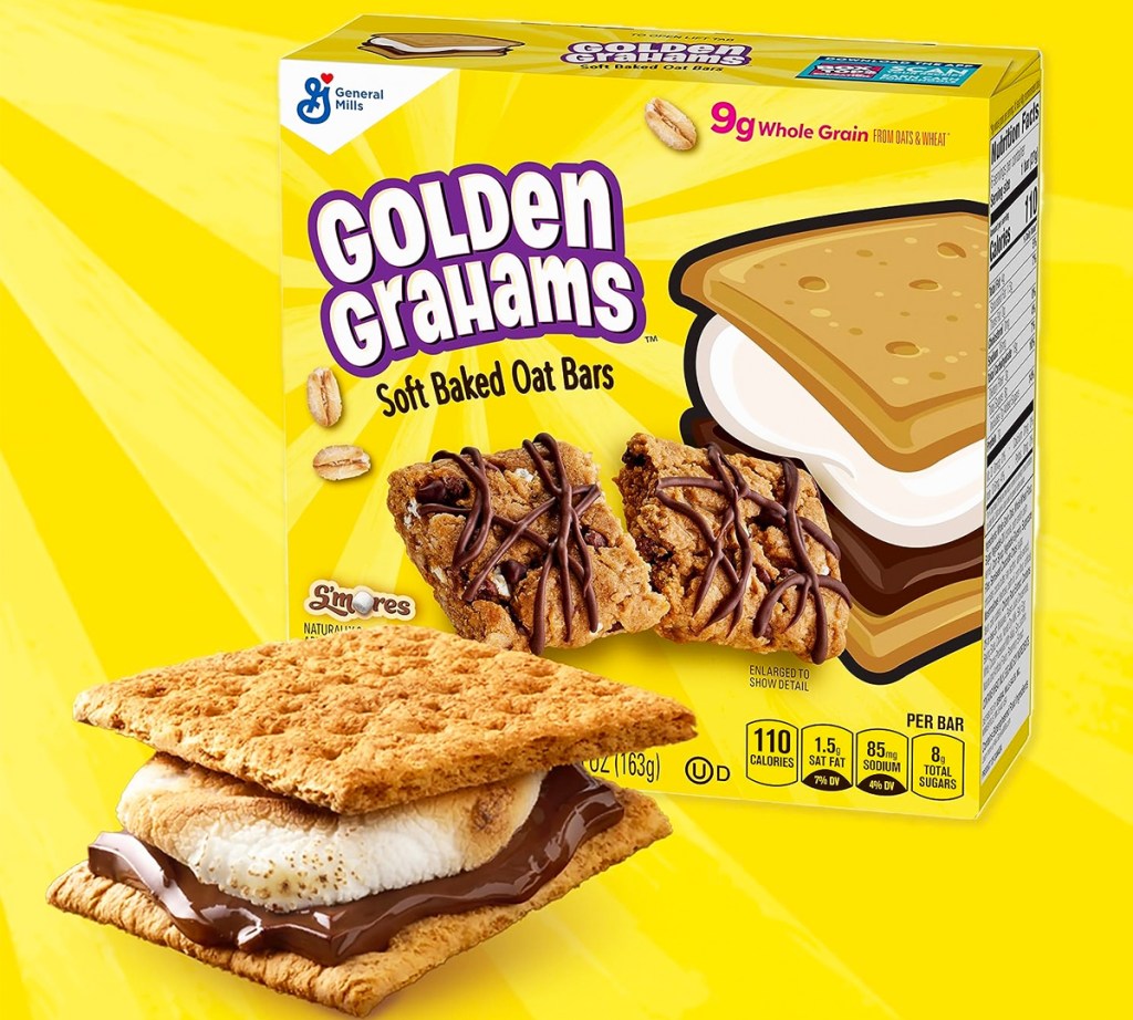 box of Golden Grahams S'mores Soft Baked Oat Bars with a s'more in front of it