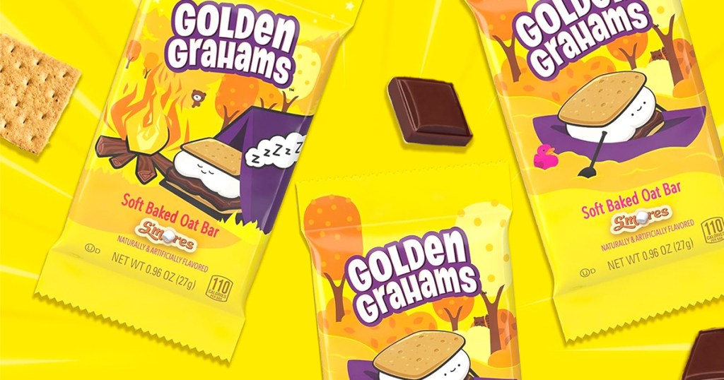 Golden Grahams S'mores Soft Baked Oat Bars on a yellow background with graham crackers and chocolate pieces