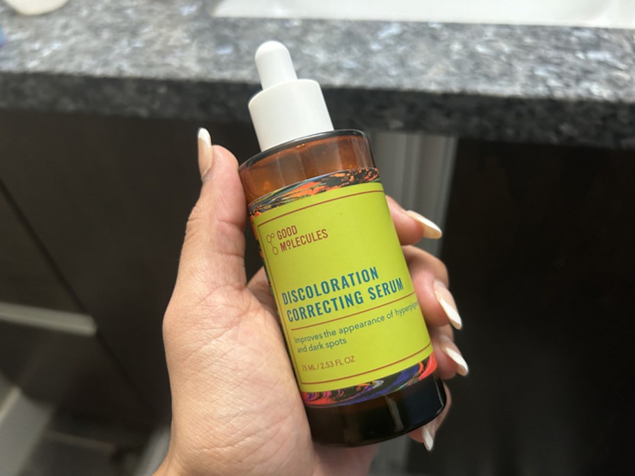 hand holding bottle of Good Molecules Discoloration Correcting Serum