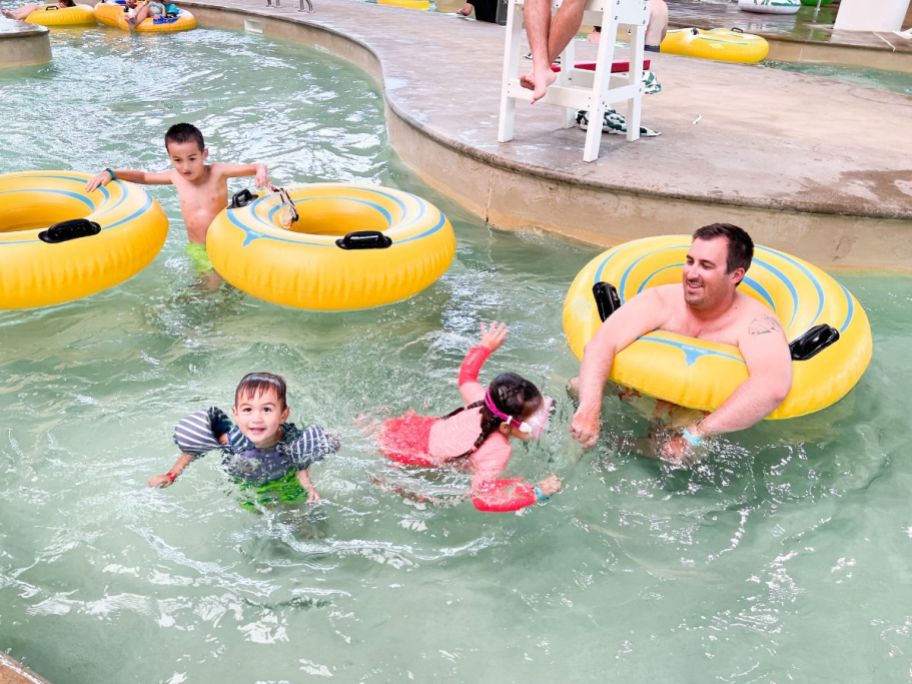family floating down lazy river indoor waterpark