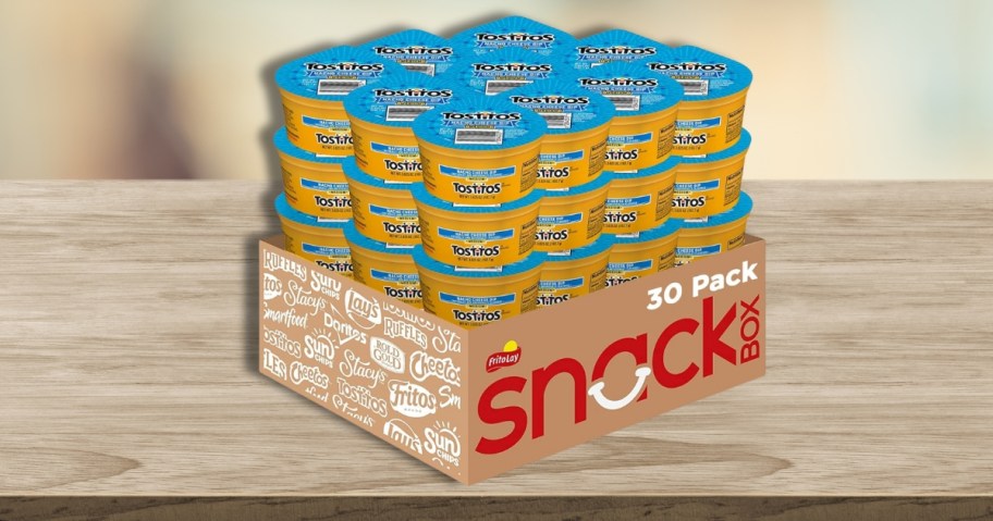 a case of individual Tostitos Queso on a table