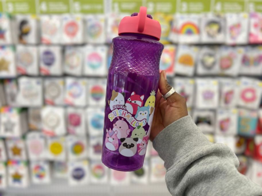 hand holding a purple and pink squishmallow water bottle at five below