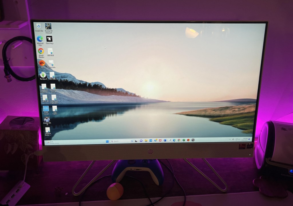 an all in one HP desktop computer with a 27 inch screen