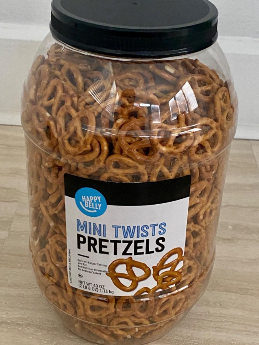 A large tub of Happy Belly mini pretzels 