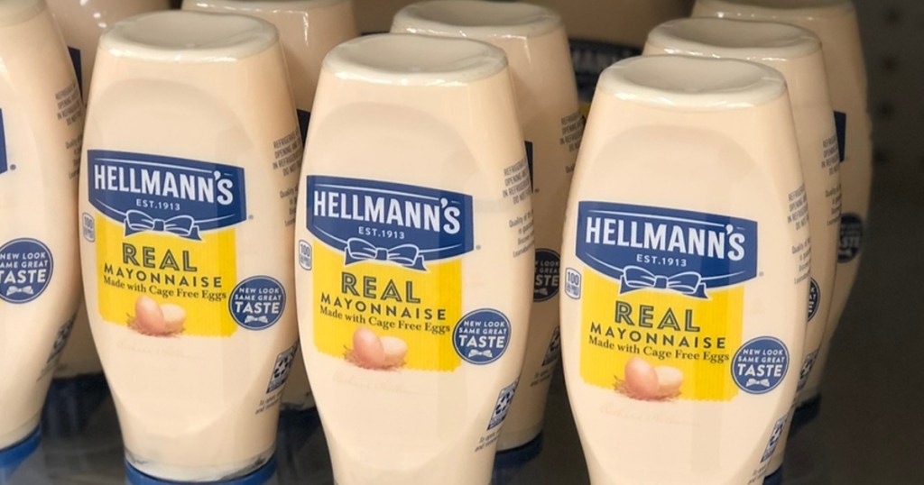 squeeze bottles of Hellmann's mayo on store shelf