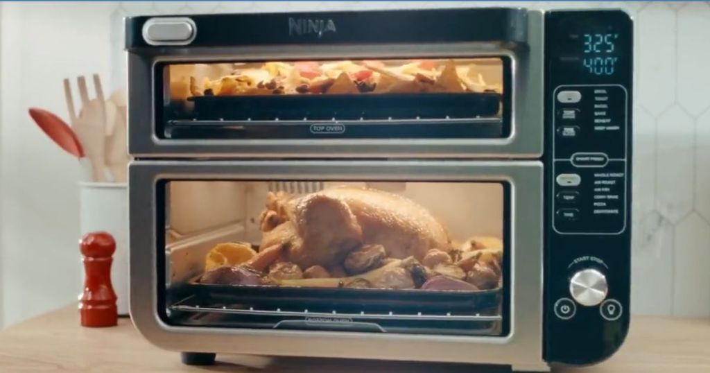Ninja 12-in-1 Double Oven with FlexDoor shown with food cooking inside
