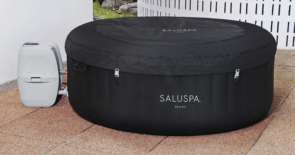 Bestway Miami SaluSpa Inflatable Hot Tub in Black shown with cover on it on a deck