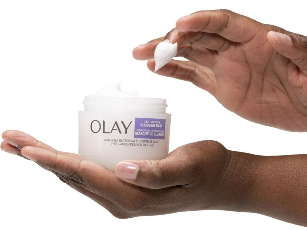 Olay Deep Moisture Slugging Mask jar shown in woman's hand