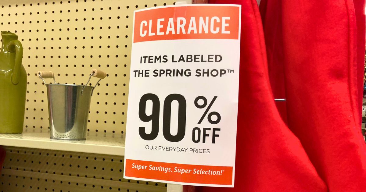 Hobby lobby clearance sign that says 90% off items labeled 'the spring shop'
