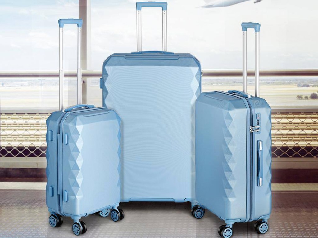 light blue 3-piece luggage set at airport