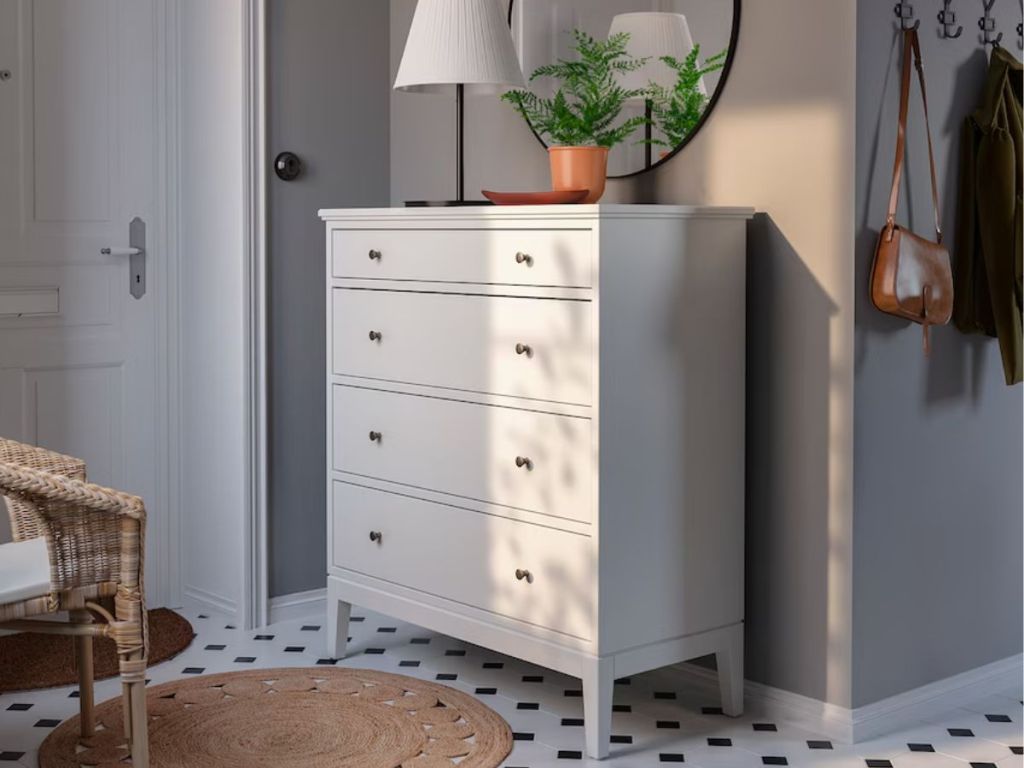 tall white 4-drawer dresser in room