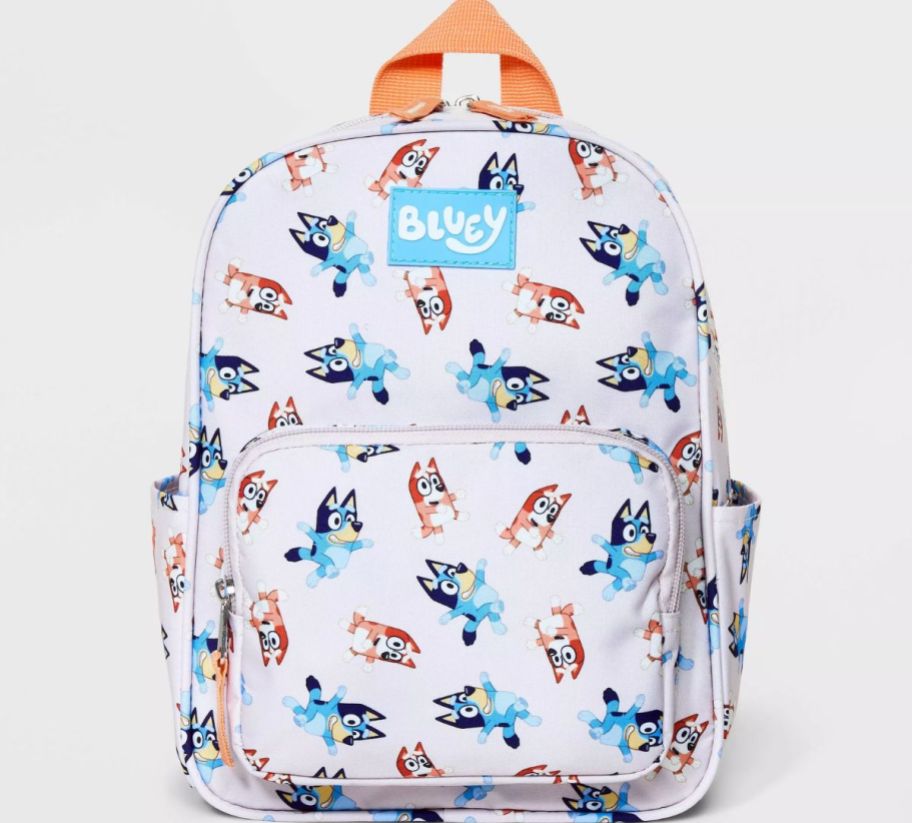 a kids mini backpack with bluey graphics printed all over it