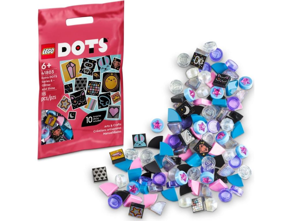 A pink Lego Dots bag with Dots spilled out on a countertop