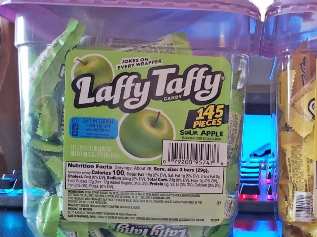 large container of sour apple taffy taffy candy